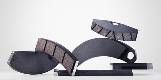 Limmade skivbromsbelägg